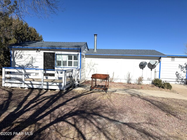 view of front of house featuring a wooden deck and french doors