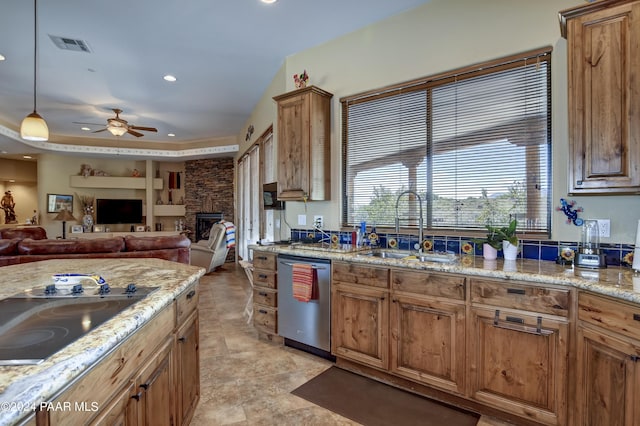 kitchen featuring dishwasher, black electric stovetop, a ceiling fan, recessed lighting, and a fireplace