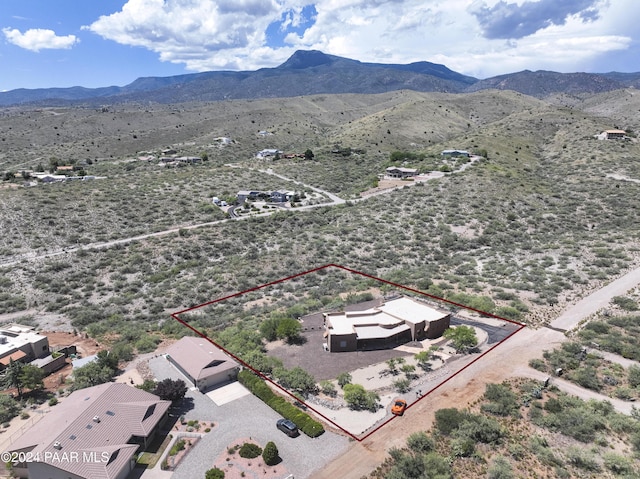 aerial view of sparsely populated area with property boundaries highlighted and mountains