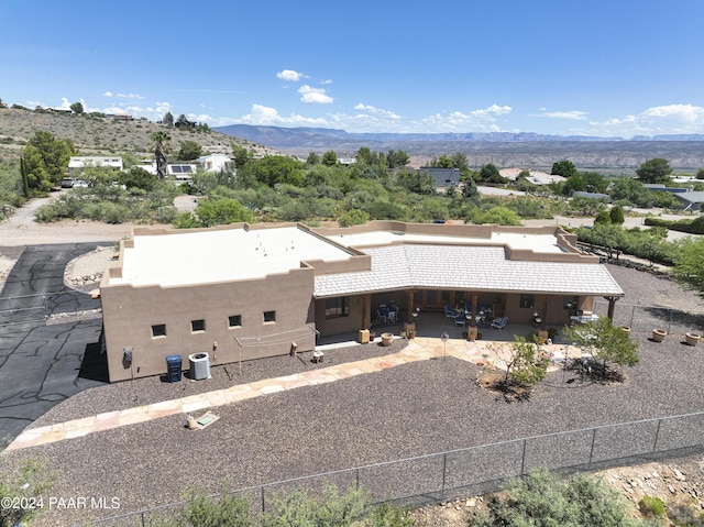 view from above of property with a mountain backdrop