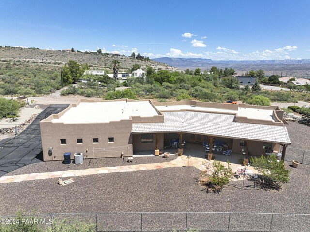view from above of property with a mountain backdrop