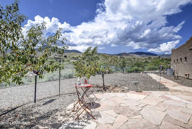 view of patio / terrace with a mountain view