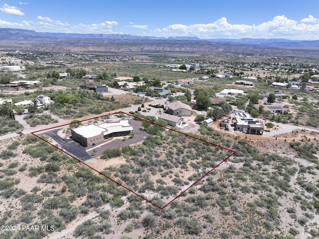 aerial view of property's location featuring property boundaries highlighted and mountains