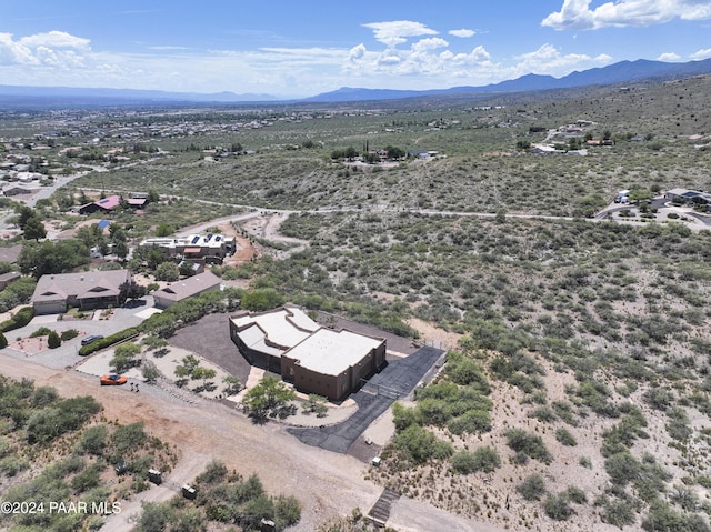 aerial view of a mountainous background and a desert landscape
