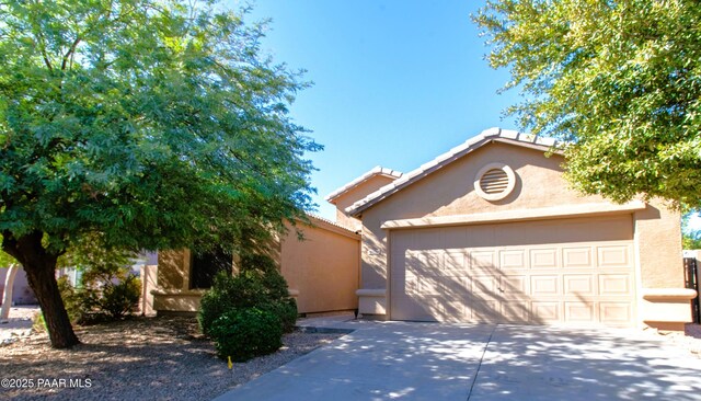 view of front of property with a garage