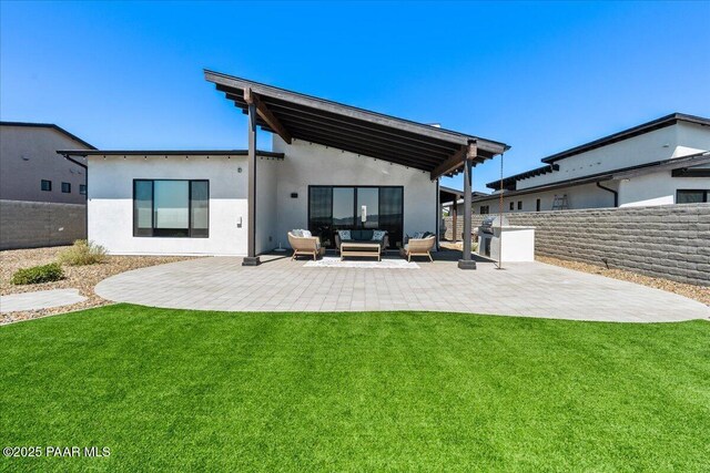 4947 Mclaury Dr, Prescott Valley, AZ 86314 - rear view of property featuring outdoor lounge area, a patio area, and stucco siding