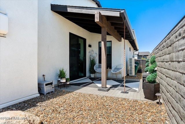 4947 Mclaury Dr, Prescott Valley, AZ 86314 - view of exterior entry featuring stucco siding and a patio