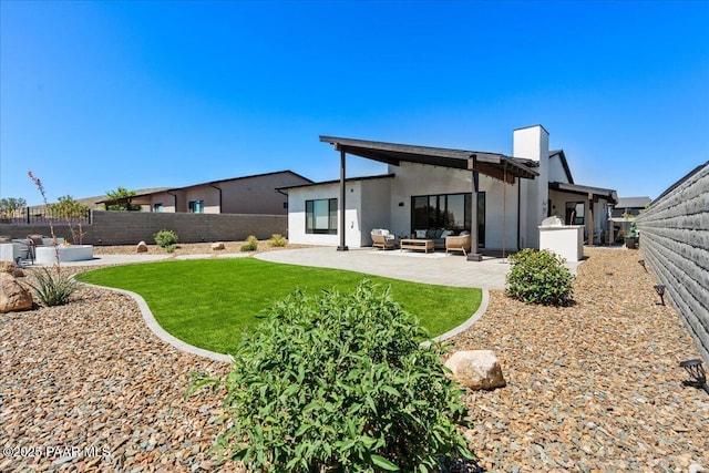 4947 Mclaury Dr, Prescott Valley, AZ 86314 - rear view of property featuring outdoor lounge area, a fenced backyard, a patio area, and stucco siding