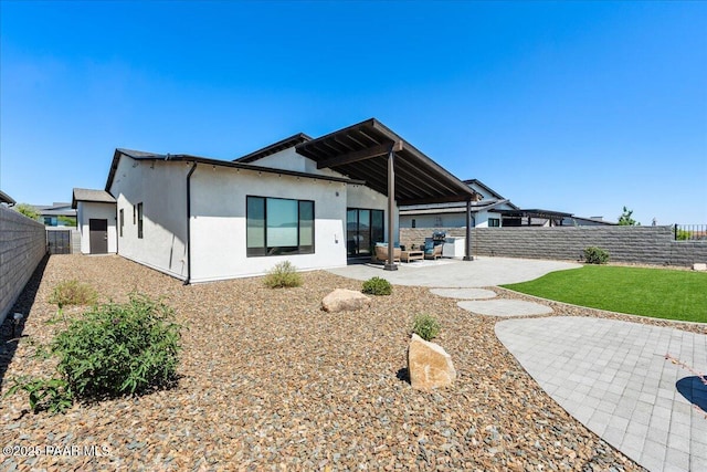 4947 Mclaury Dr, Prescott Valley, AZ 86314 - rear view of property featuring stucco siding, a fenced backyard, and a patio area