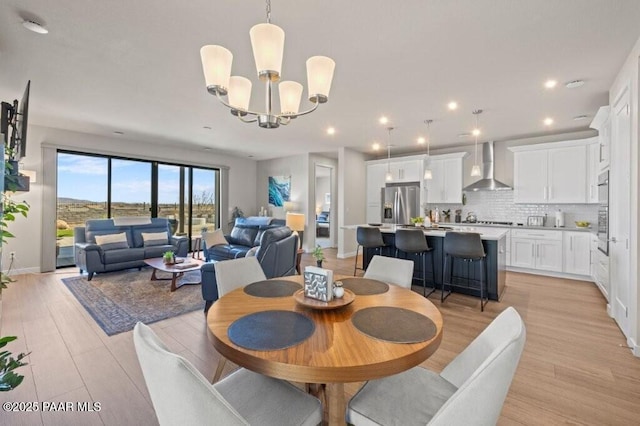 4947 Mclaury Dr, Prescott Valley, AZ 86314 - dining area featuring a chandelier, light wood-style flooring, and recessed lighting
