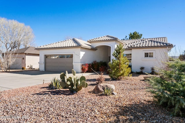 mediterranean / spanish-style house featuring a garage