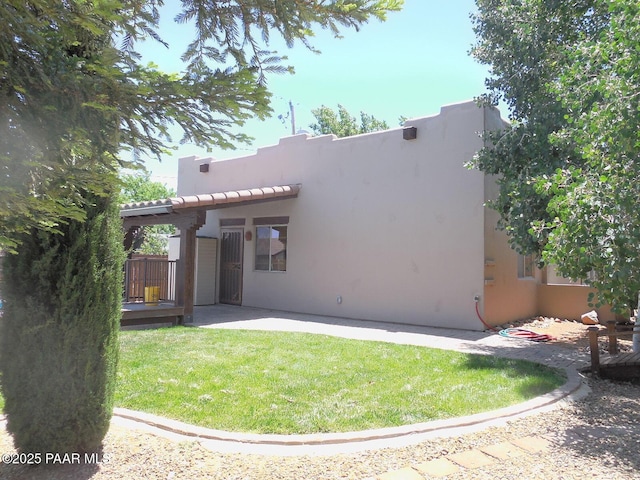 3575 N Meadowlark Dr, Prescott Valley, AZ 86314 - rear view of house with stucco siding, a lawn, a patio, and a tiled roof