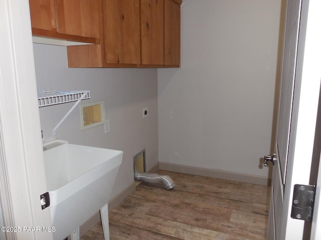 3575 N Meadowlark Dr, Prescott Valley, AZ 86314 - washroom with electric dryer hookup, light wood finished floors, baseboards, washer hookup, and cabinet space