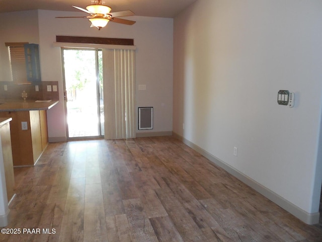 3575 N Meadowlark Dr, Prescott Valley, AZ 86314 - unfurnished dining area featuring a ceiling fan, light wood finished floors, and baseboards