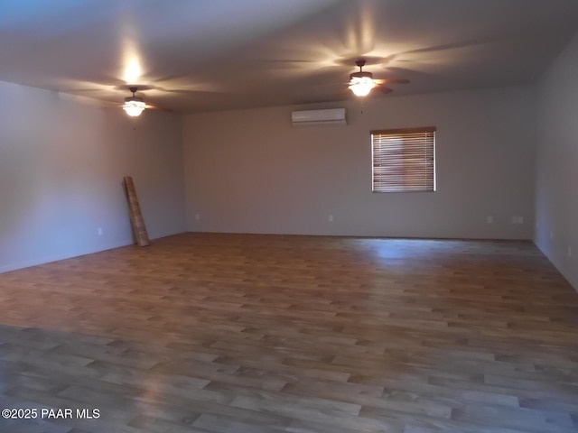 3575 N Meadowlark Dr, Prescott Valley, AZ 86314 - unfurnished room featuring ceiling fan, an AC wall unit, and wood finished floors