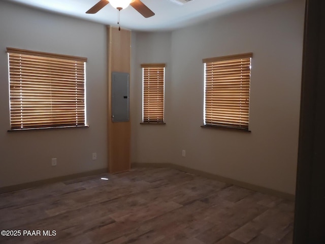 3575 N Meadowlark Dr, Prescott Valley, AZ 86314 - unfurnished room with electric panel, ceiling fan, wood finished floors, and baseboards
