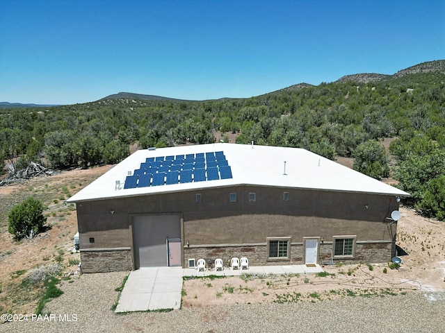 exterior space featuring a mountain view