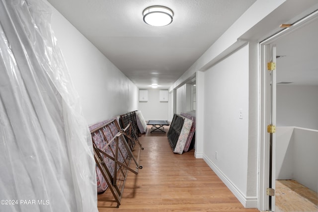 hall with light wood-type flooring