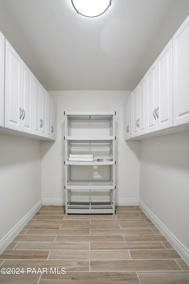 laundry room featuring light hardwood / wood-style flooring