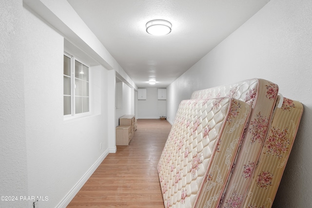 hallway featuring light wood-type flooring