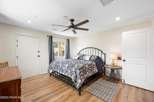 bedroom featuring light wood-style flooring, recessed lighting, and visible vents