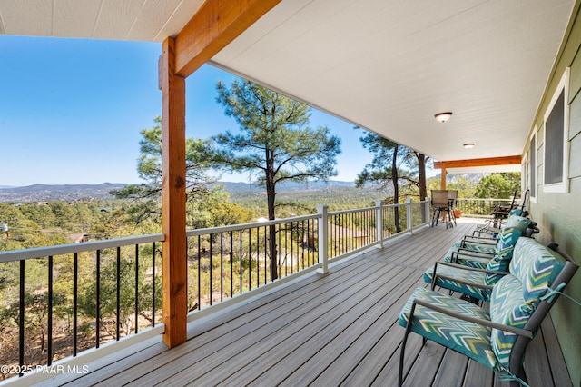 wooden terrace featuring a mountain view