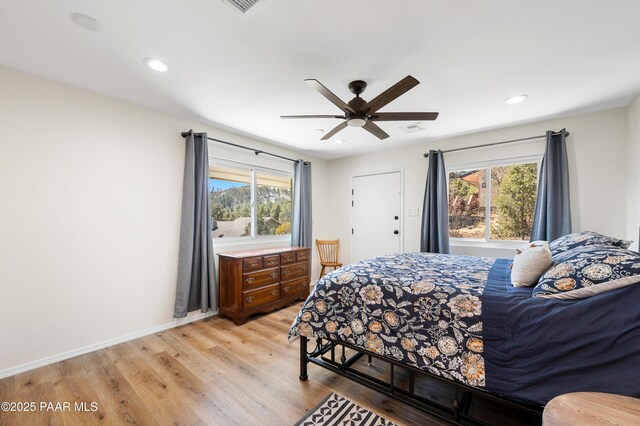 bedroom featuring visible vents, baseboards, recessed lighting, light wood-style floors, and a ceiling fan