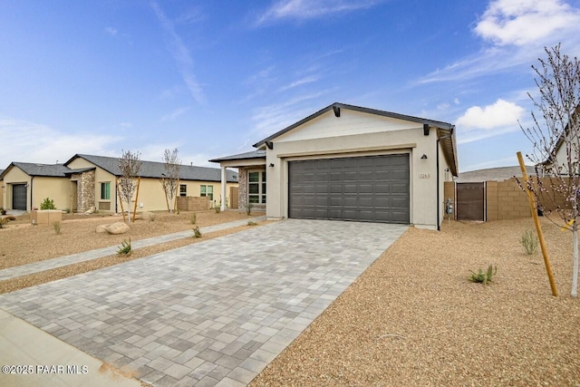 3263 Iron King Cir, Prescott, AZ 86301 - ranch-style house featuring decorative driveway, stucco siding, a garage, and fence
