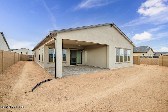 3263 Iron King Cir, Prescott, AZ 86301 - back of property featuring stucco siding, a patio area, and a fenced backyard
