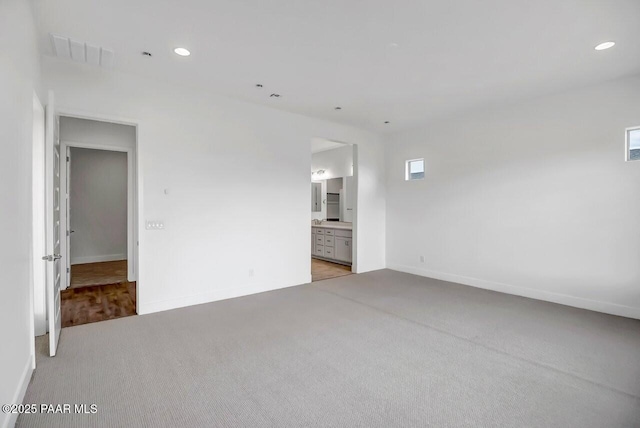 3263 Iron King Cir, Prescott, AZ 86301 - empty room featuring light carpet, baseboards, and recessed lighting
