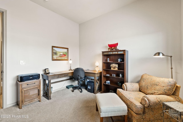 carpeted office space with baseboards