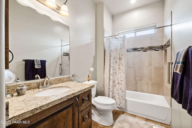 bathroom with shower / bath combination with curtain, toilet, vanity, and wood finished floors