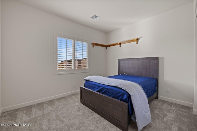 bedroom featuring carpet floors, visible vents, and baseboards