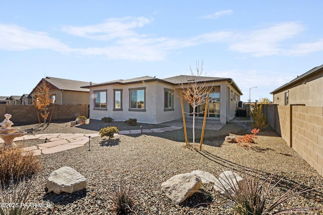 rear view of house with a patio