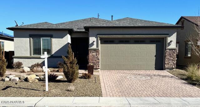 view of front of house with a mountain view and a garage