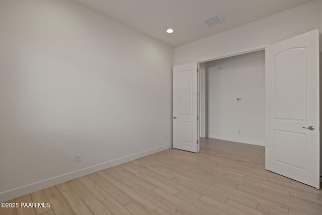 unfurnished bedroom with recessed lighting, baseboards, visible vents, and light wood finished floors