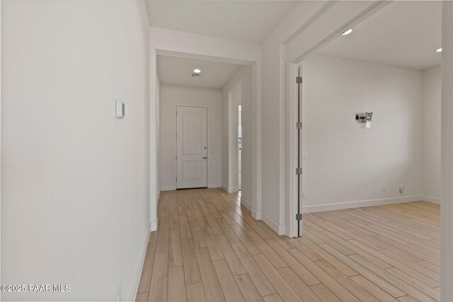 spare room featuring light wood-type flooring