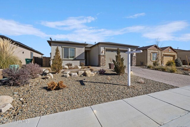 view of front facade featuring a garage and a mountain view