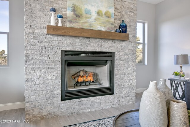 12312 N Otto Cir, Prescott, AZ 86305 - interior details with a stone fireplace, wood tiled floor, and baseboards