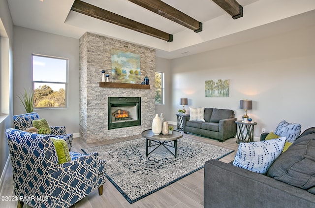 12312 N Otto Cir, Prescott, AZ 86305 - living room with baseboards, beamed ceiling, wood finished floors, and a healthy amount of sunlight