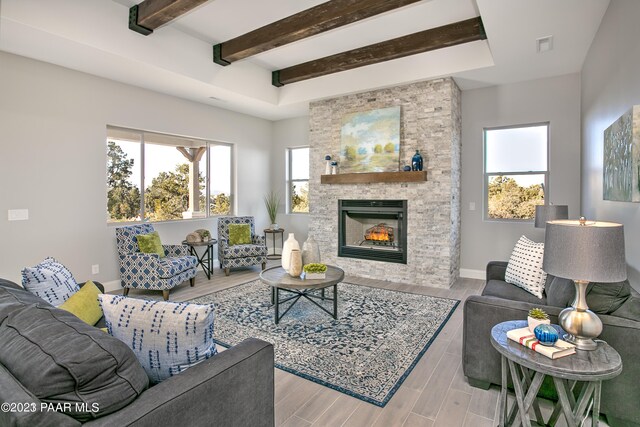 12312 N Otto Cir, Prescott, AZ 86305 - living area with plenty of natural light, wood tiled floor, beamed ceiling, and baseboards