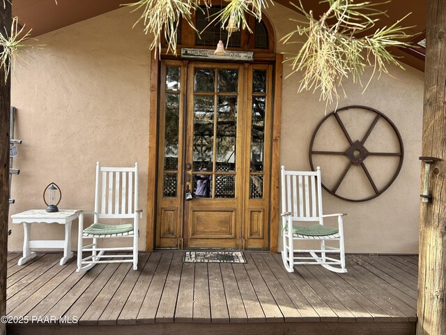 entrance to property with a porch