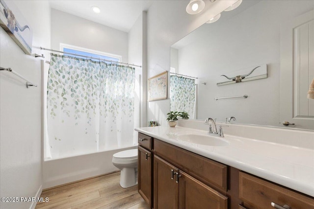 full bathroom featuring toilet, shower / tub combo, vanity, and hardwood / wood-style floors