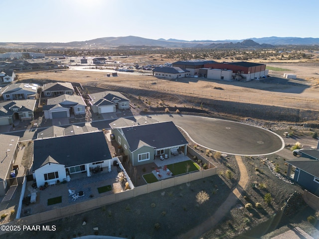 birds eye view of property with a mountain view