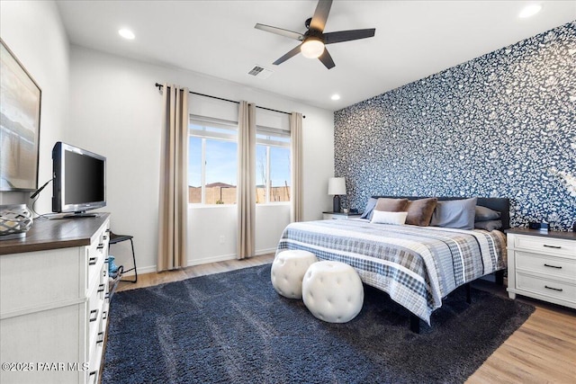 bedroom featuring ceiling fan and light wood-type flooring