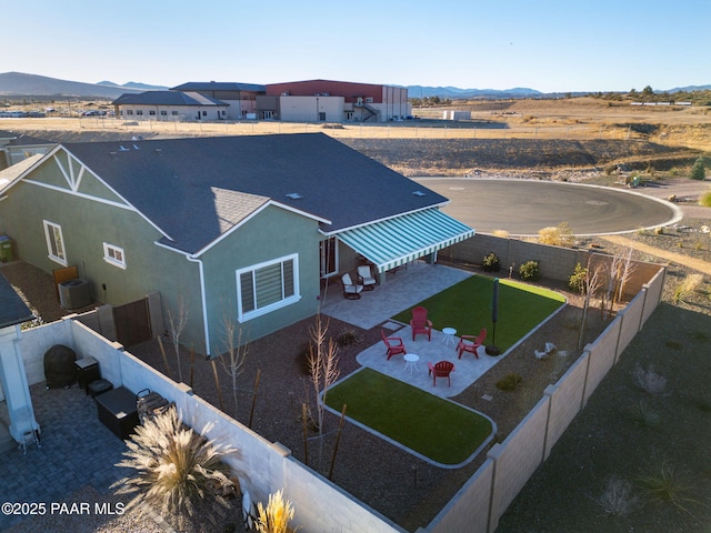 birds eye view of property with a mountain view