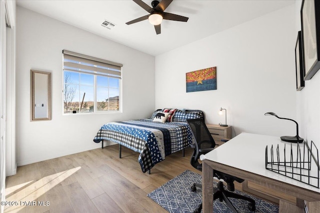 bedroom featuring ceiling fan and light wood-type flooring