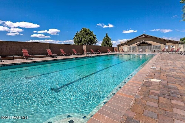 view of swimming pool featuring a patio area