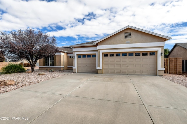 single story home with a garage