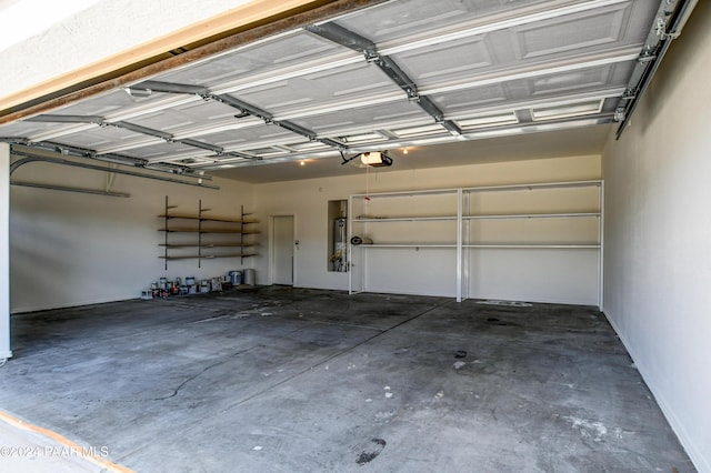 garage with a garage door opener and water heater